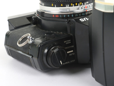 A Black Olympus OM-2 Spot/Program Camera and Lenses - 10