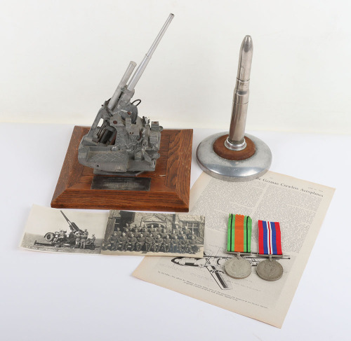 Presentation Trophy of a Anti-Aircraft Gun and Medals Relating to Sergeant Smith ‘The Flying Bomb Victor’