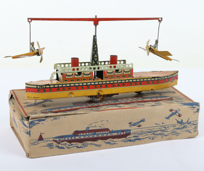 Scarce boxed CKO Kellermann clockwork tinplate ship with circling Monoplanes carpet toy 226/7, German 1920s