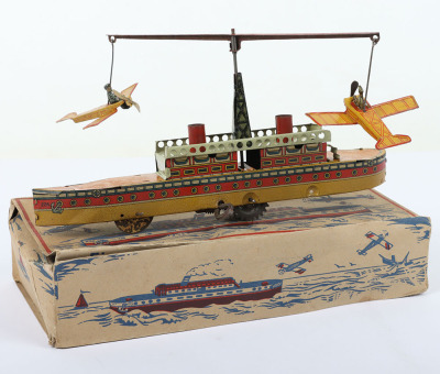 Scarce boxed CKO Kellermann clockwork tinplate ship with circling Monoplanes carpet toy 226/7, German 1920s - 2