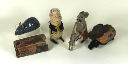 Four wind-up toys including Schuco flute playing Little Pig