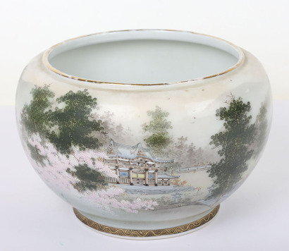 A 20th century Japanese Satsuma bowl on associated wood base