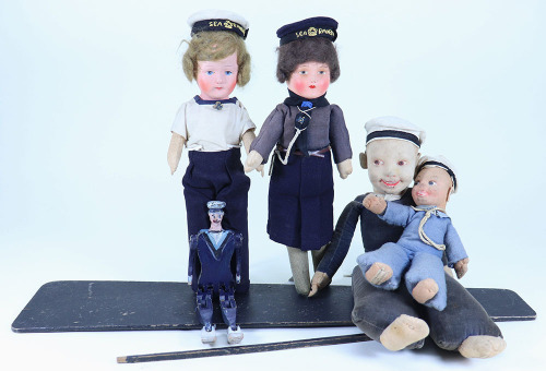 A painted wooden Sailor Dancing Jigger doll and four Sailor dolls, 1930s,