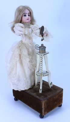 A Renou Little Girl with mirror and hair tongs Automata, French 1890s, - 2