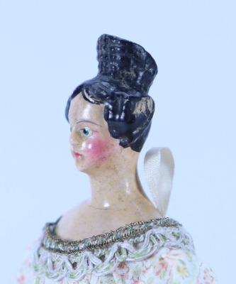 A small papier-mache shoulder head doll with Apollo knot, German 1840s, - 2