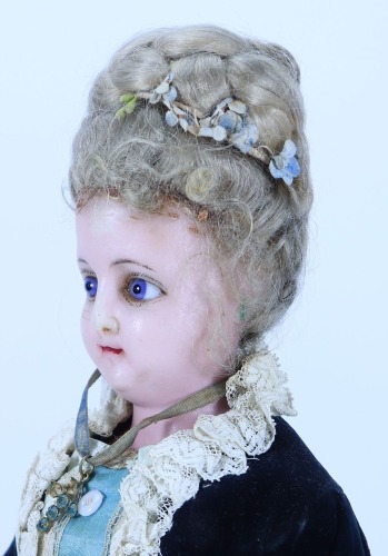 A &lsquo;Queen Alexandra&rsquo; portrait wax over composition shoulder head doll, German circa 1905,