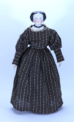 A glazed china shoulder head doll, German 1860s, - 2
