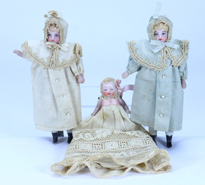 A pair of all original miniature painted bisque shoulder head twin dolls, circa 1910,