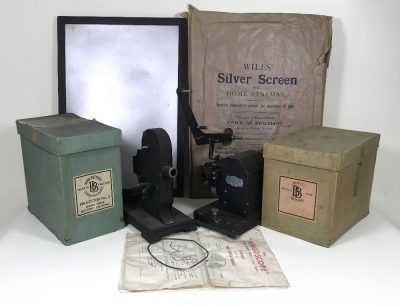 Two boxed Bing (British) &lsquo;Bingoscope&rsquo; hand driven home projectors