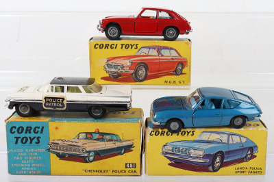 Three Boxed Corgi cars