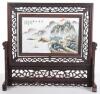 A Chinese porcelain handpainted table screen, on hardwood mount