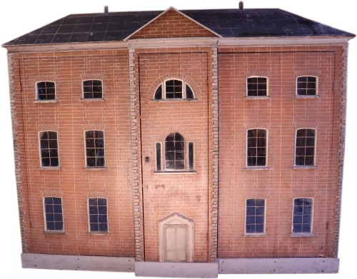 A large and impressive painted wooden red brick dolls house, Irish circa 1820,