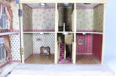 An impressive Christian Hacker painted wooden Dolls House, German 1890s, - 2