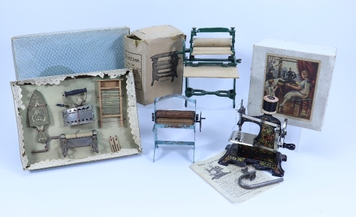 A selection of children’s kitchen and domestic toys, 1920s-50s,