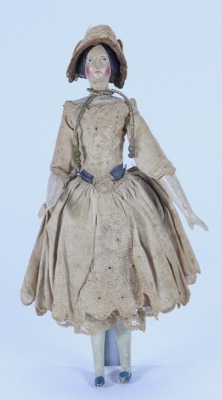 A Papier-mache shoulder head doll on wooden body and in original clothes, German circa 1830,