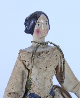 A Papier-mache shoulder head doll on wooden body and in original clothes, German circa 1830, - 2