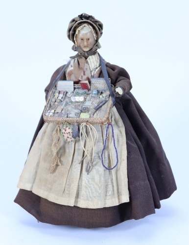 A good all original wax pedlar doll on wooden body, German 1830s,