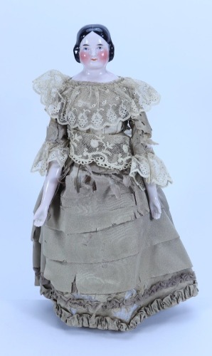 A good glazed china shoulder head doll, German circa 1840,