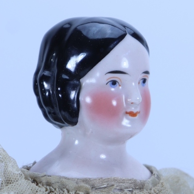A good glazed china shoulder head doll, German circa 1840, - 2