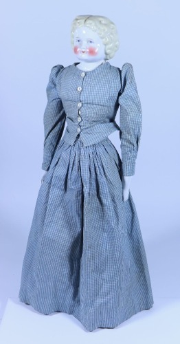 *A glazed china shoulder head doll, German circa 1860,