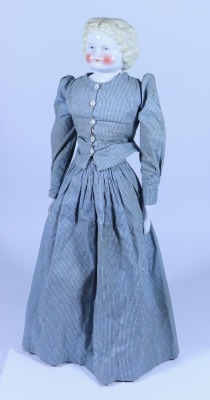 *A glazed china shoulder head doll, German circa 1860,