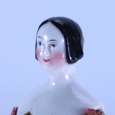 A miniature glazed china shoulder head doll on jointed wooden body, German mid 19th century, - 2