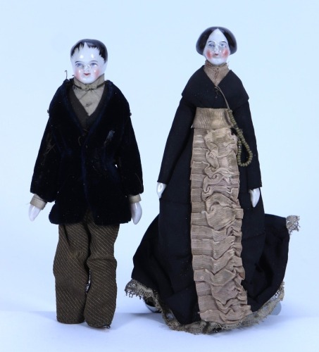 A pair of miniature glazed china shoulder head dolls on jointed wooden bodies, German mid 19th century,