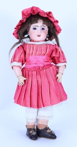 A ‘Modelle’ bisque head Bebe doll in original clothes, French circa 1890,