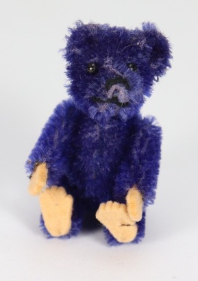 A miniature Schuco mauve mohair Teddy bear, German 1920s,