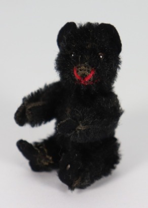 A miniature Schuco black mohair Teddy bear, German 1920s,