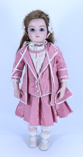 A reproduction Bru Jne bisque shoulder head doll, size 13,