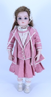 A reproduction Bru Jne bisque shoulder head doll, size 13,