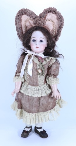 A reproduction Jumeau Triste bisque head doll, size 13, 1988,
