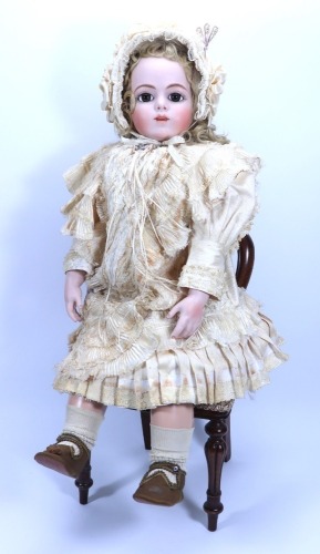 A large reproduction Bru Jne bisque shoulder head doll, size 13,