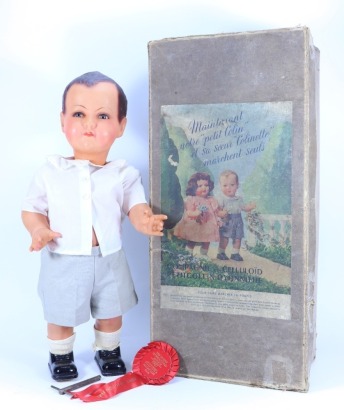 A ‘Petit Colin’ celluloid walking doll in original box,