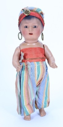 A Heubach Koppelsdorf 452 all original sprayed bisque ethnic doll, German circa 1920,