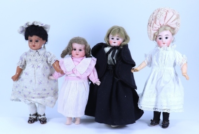 Four small bisque head girl dolls, German, circa 1915