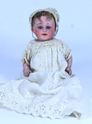 A Gebruder Heubach 8420 bisque head ‘Pouty’ baby doll, German circa 1910,