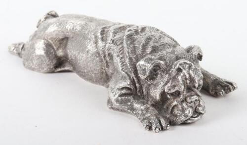 A heavy silver model of a recumbent pug dog, London 1976