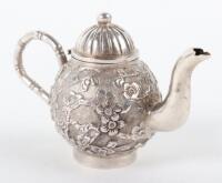 A miniature silver Chinese teapot