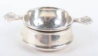 A silver tea strainer on stand, Birmingham 1920,