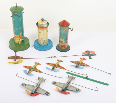 Three tinplate Aero-tower novelty toys