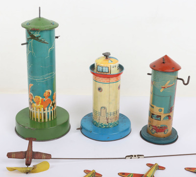 Three tinplate Aero-tower novelty toys - 3