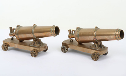 Pair of brass model carronade