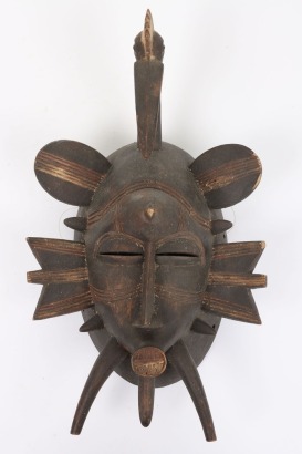 Carved wooden mask,