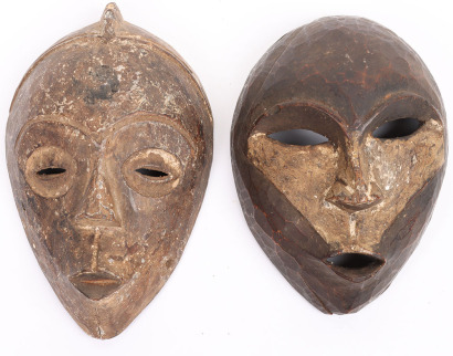 2 small carved wooden masks