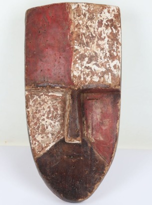 Duma carved and polychrome decorated shield-shaped mask from Gabon