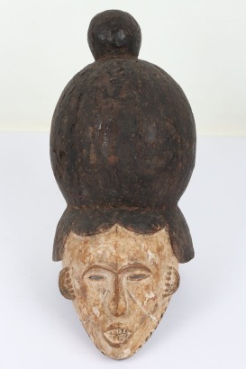 Carved and bichrome decorated wooden face mask
