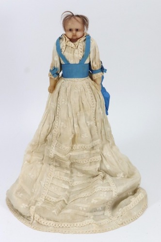 *A sweet all original poured wax baby doll, English circa 1860,