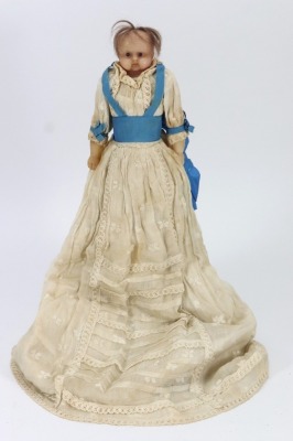 *A sweet all original poured wax baby doll, English circa 1860,